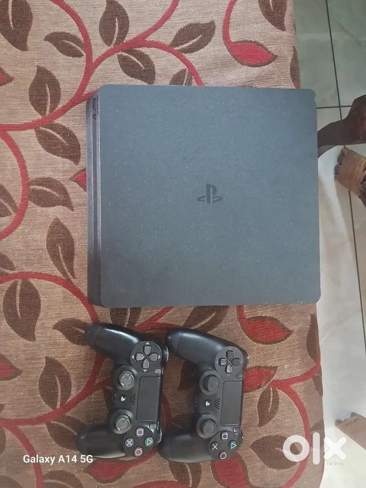 Ps4 slim with two controllers and 10 games one and half year used