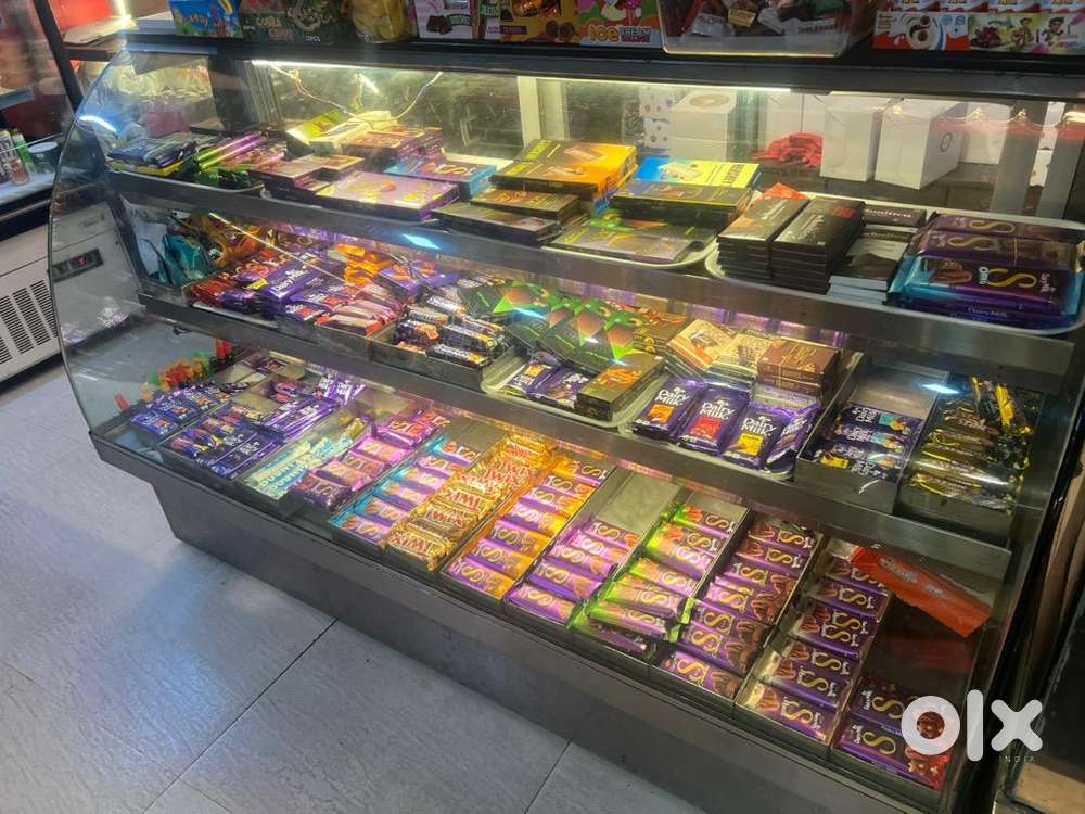 Cake Display Counter , Hot cookies , Puff Fridge .