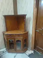 Corner TV trolley in heavy wood for sale.