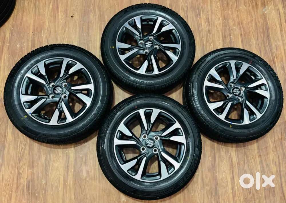 15inch oem swift alloys with Bridgestone tyres set of 4 500 km run