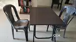 Two plastic chairs and one study table