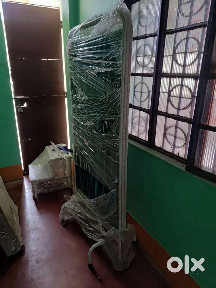 Clinic bed and curtains stand
