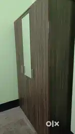 Three door with multiple storage with mirror wardrobe. URGENT