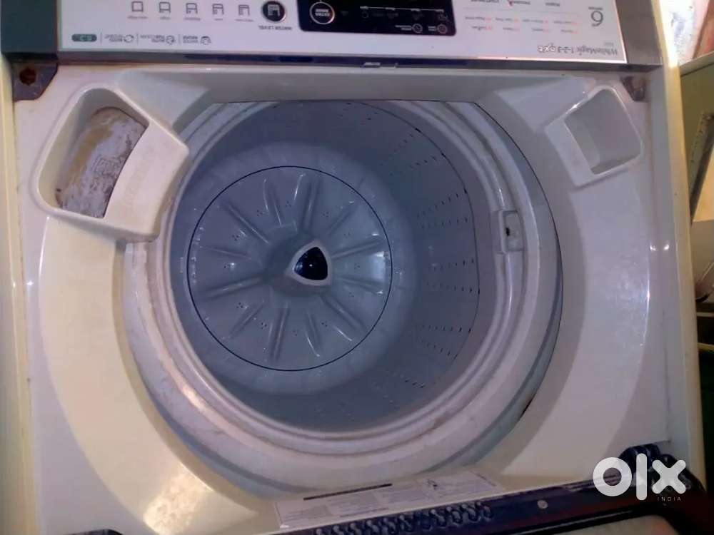 Used washing machine top load in good condition .