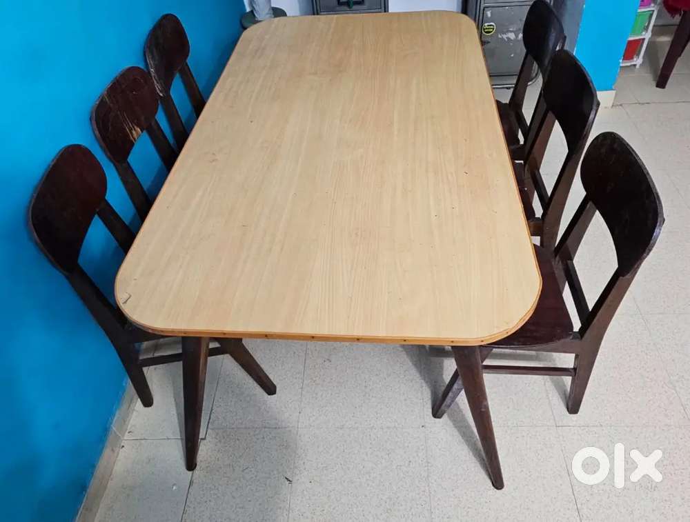 Teak framed dining table with 6 chairs
