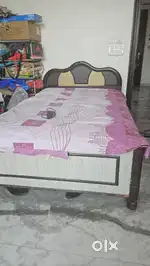 Bed for sale with box size is bigger than single but not double.