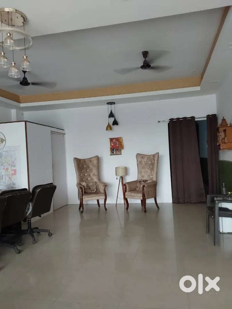 On main road facing office space