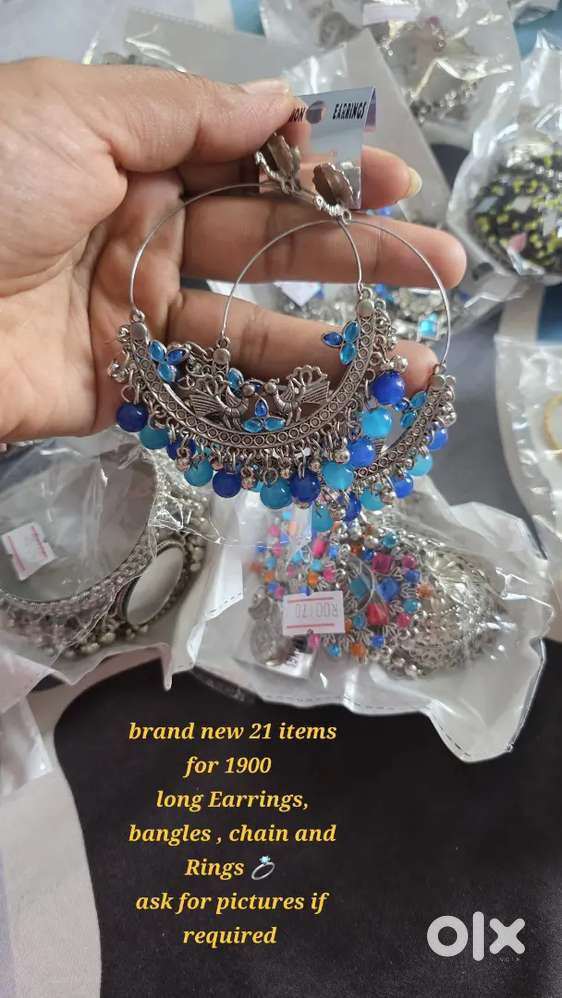 Brand new long Earrings , bangles , rings , chain. 21 items for 1900.