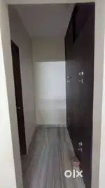 2 room set with living area, open kitchen, and pooja room. Wardrobe, A