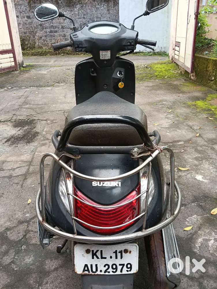 A lady used Suzuki Access scooter