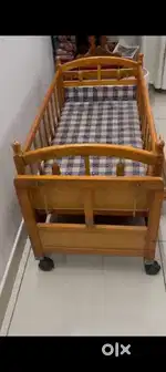 Baby cot with swing