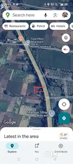 Plot on main road