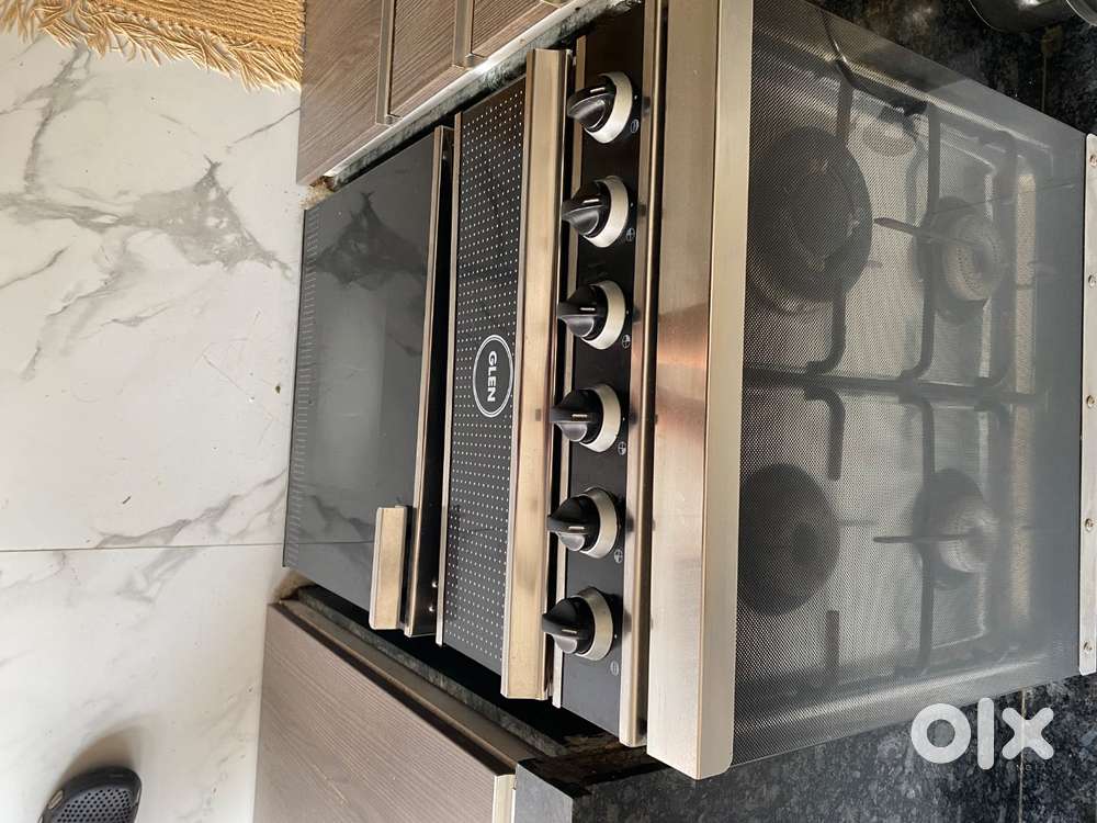 Brand new, barely used cooking range 4 burner over grill for sale