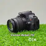 Canon EOS Rebel T5i DSLR Camera with 18-55mm f/3.5-5.6 IS II Lens.