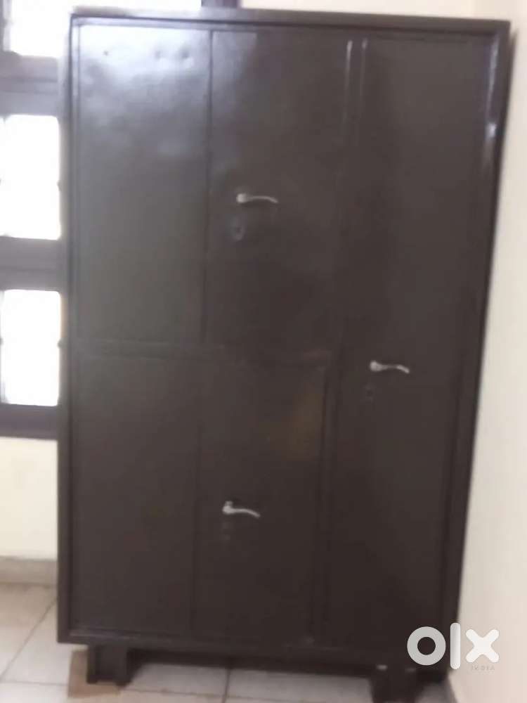 Steel almirah and double bed with gadde