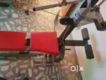 Gym machine with weights, rods etc