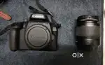 Unused Canon EOS 3000D DSLR camera with lens