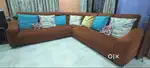 L-shaped 7 seater sofa along with a 3 seater sofa cum bed and 6 chairs