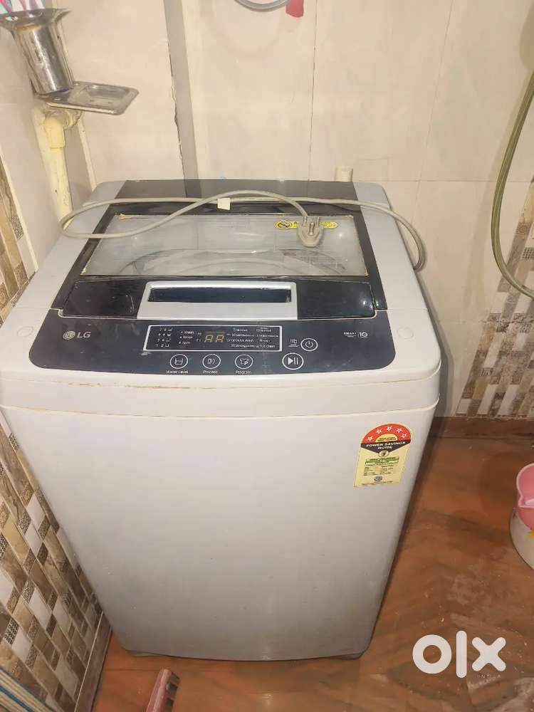 LG T0P LOAD WASHING MACHINE