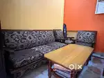 Wooden sofa with soft cushions