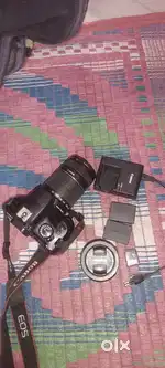 Canen EOS1300D 50 mm lenses and 55 to 200 lenses charger to batteries