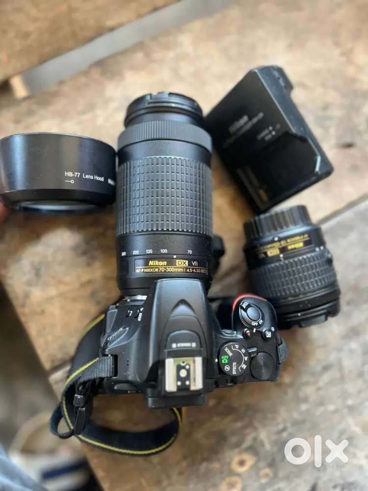 It is a screen touch camera with 18-55 and 70-300 mm lens Argent money