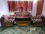 5 seated sofa with a table