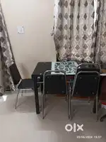 4 seater glass top dining table with chairs