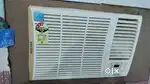 Selling voltas window ac with remote and iron stand, running condition