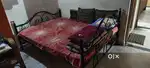 Metal cot with playwood.
