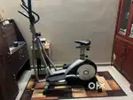 Elliptical cross trainer with seat