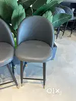 High stools, tables, AC & imported plants.