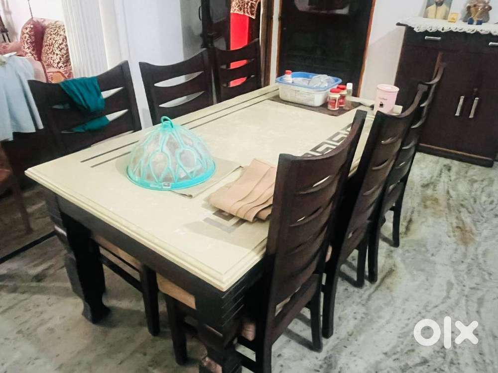 6 seater dining table with fancy marble on top