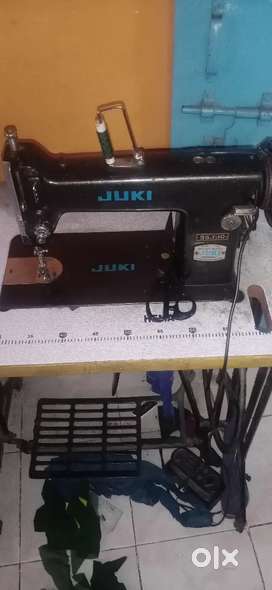 Sewing machine with table and motor and peddle