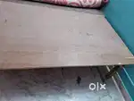 Two single  wooden beds recently made