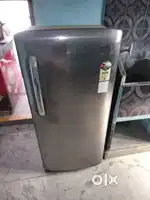 Refrigerator and wooden table