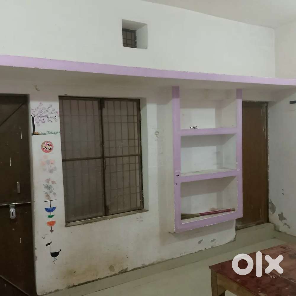 Big room attached latrine bathroom with bed and fan