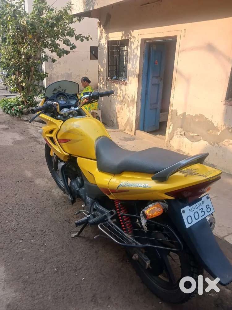 Hero Karizma bike (Yellow color) in well-maintained condition.