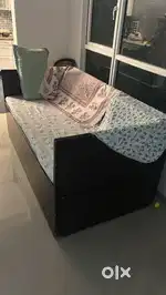 A cot 6*3 full one piece with a storage box and a drawer