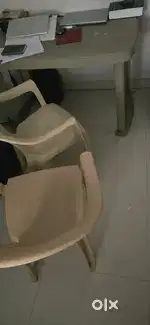 Plastic table and 2 chairs .