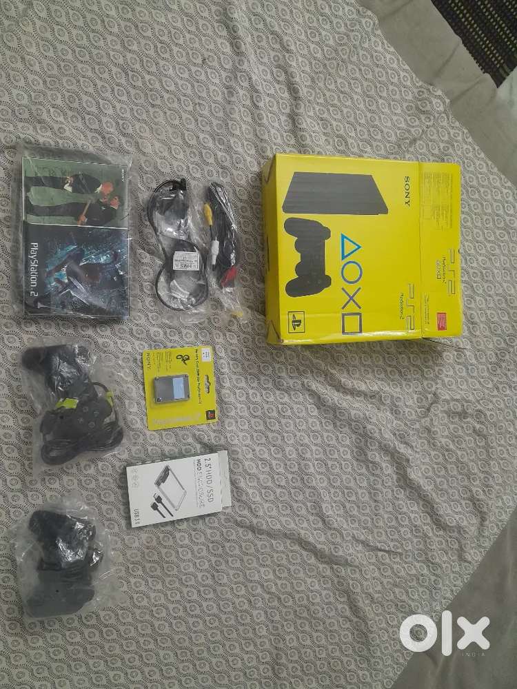 Play station 2 refurbished 2 joystick one 8mb memorycard 1hdd also box