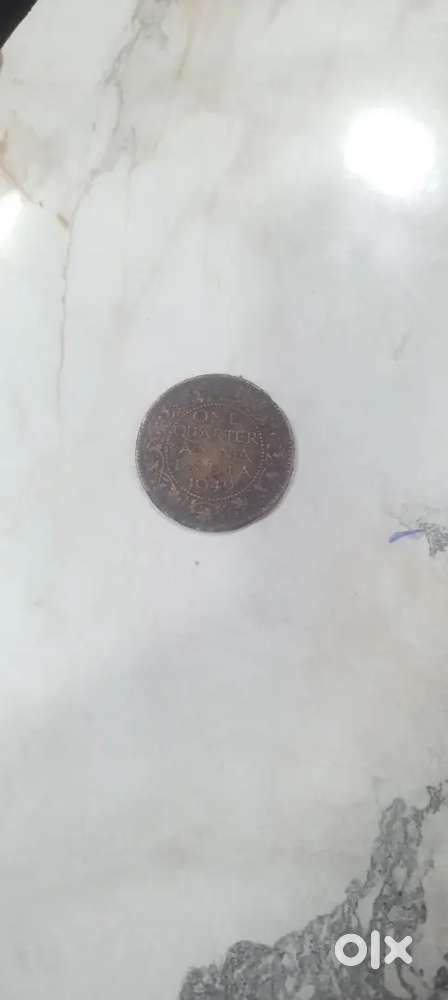 One quarter an na india coin1942