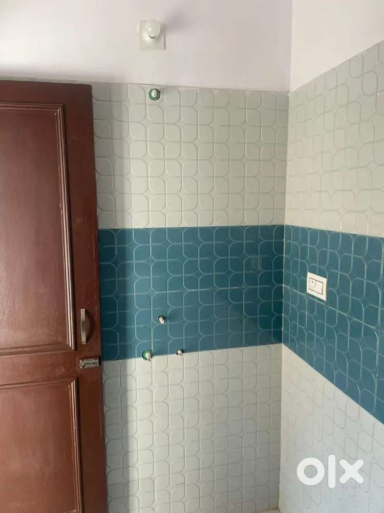 Room with attached kitchen and bathroom at skampari