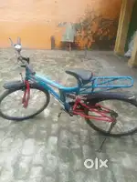 It has a red and blue frame , front  and rear suspension