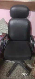 Computer table with old computer cpu revolving chair