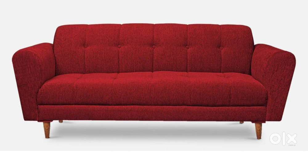 Three seater cushioned sofa