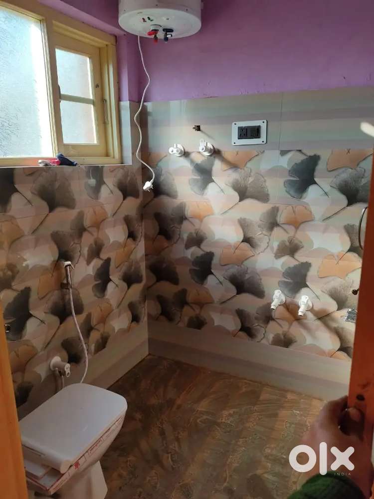 Room with attached washroom and kitchen..