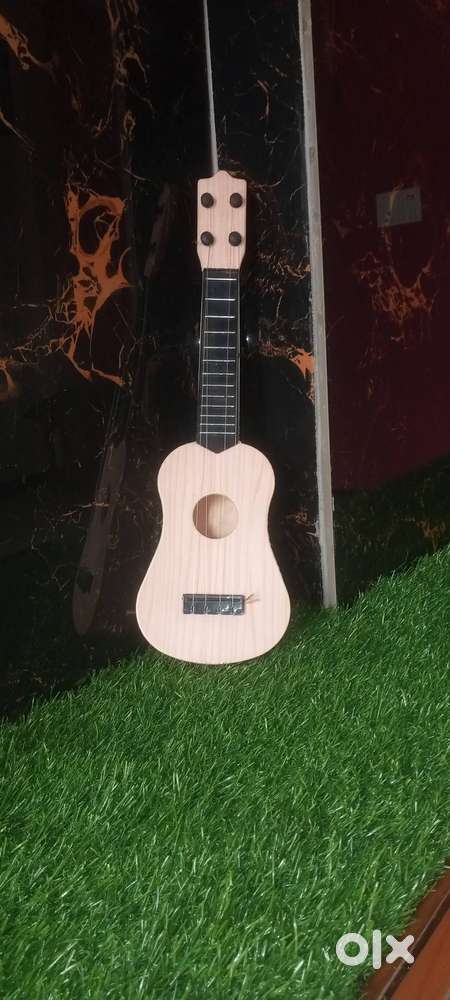 Mini guitar bacchon ke liye‍‍‍‍‍‍‍‍