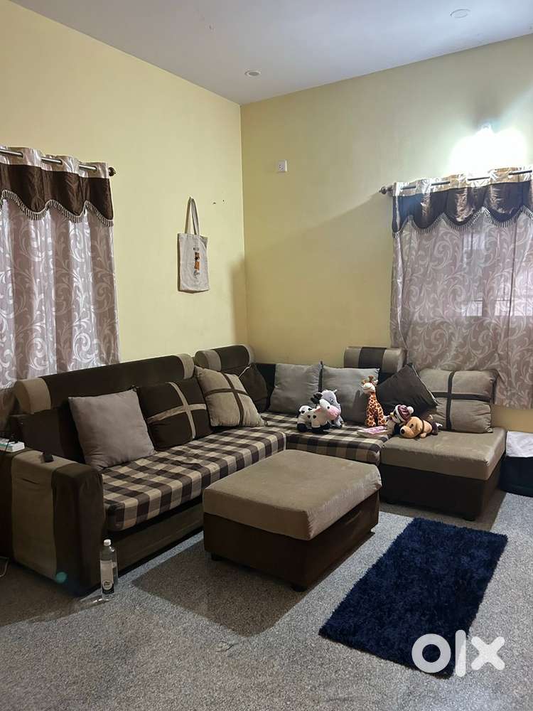 L shape sofa with pillows