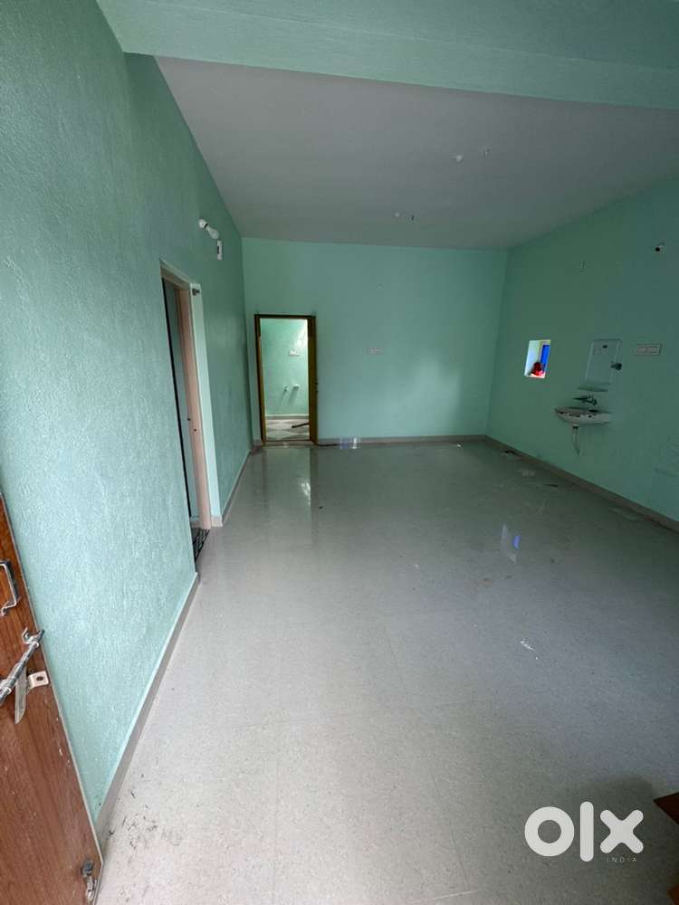 Newly constructed House in front of rock garden parking